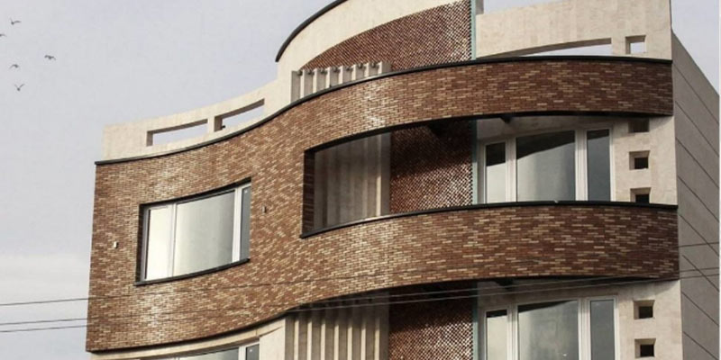 نمای ساختمان و دلیل استفاده ترکیبی از آجر و سنگ در آن